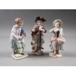 Three late 19th century Continental porcelain figures, boy with dog, 4" high, young gardener, 4 1/2"