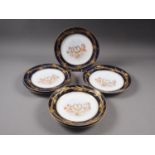 Six Sevres plates with central putti decoration and blue and gilt decorated borders, 9 1/2" dia (