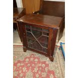 A mahogany side cabinet enclosed lattice glazed door, on bracket feet, 28" wide x 15 1/2" deep x 30"