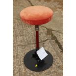 A dentist's 1930s "rest and relief" stool with spring action and padded seat, on circular base