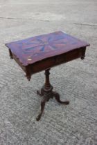 A late 19th century carved walnut and parquetry shape top work table with part fitted interior, on
