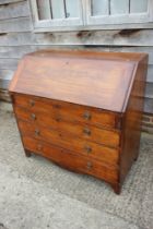 A Georgian mahogany fall front bureau, the interior fitted pigeonholes and drawers over four long