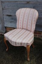 A polished as walnut side chair of Louis XVI design, upholstered in a pink striped fabric, on