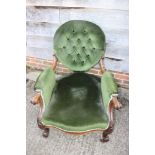 A Victorian button back deep seat open arm show frame chair, on cabriole supports