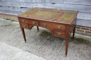 A late 19th century mahogany writing desk, with tooled leather adjustable writing surface, over