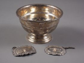 A silver rosebowl, on circular foot, 2.6oz troy approx, and two other silver decanter labels, whisky