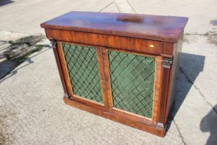 A Regency rosewood chiffonier, fitted frieze drawer over two brass lattice panel doors, on block