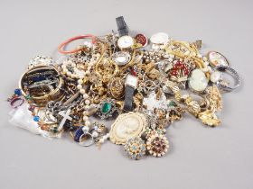 A quantity of costume jewellery to include bracelets, necklaces, brooches, wrist watches, bangles