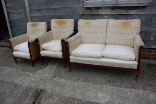 An Edwardian mahogany and line inlaid two-seat settee with loose cushions, on slender supports,  a