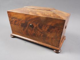 A mahogany sarcophagus tea caddy, on bun feet with associated mixing bowl, 12 1/2" wide