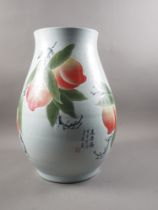 A Chinese porcelain baluster vase, decorated peaches and script, 19 1/2" high