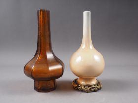 An amber-coloured Peking glass vase of octagonal form, 7 3/4" high, and a Continental cream glazed