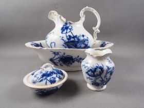A late 19th century blue and white scroll toilet jug and basin set, and a box and toothbrush vase