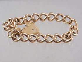 A 9ct gold curb link bracelet with heart-shaped padlock clasp, 41.1g
