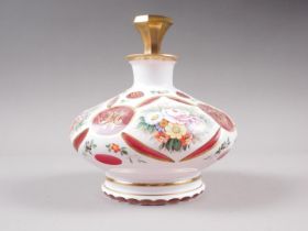 A 19th century Bohemian ruby overlaid milk cut glass scent bottle and stopper with floral and gilt