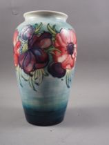 A mid 20th century Moorcroft "Anemone" pattern tapered cylindrical vase with Queen Mary label to