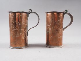 A pair of Newlyn copper mugs, decorated leaves and flowers, 4 1/2" high