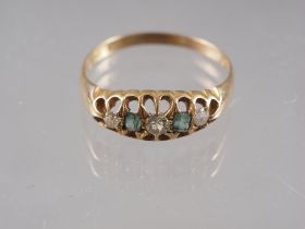 An 18ct gold, diamond and emerald set dress ring, size S, 3.2g