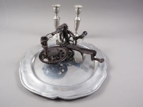 A shaped pewter dish, 14" dia, a pair of pewter candlesticks and a vintage apple corer