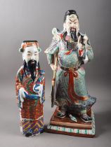 A Chinese porcelain figure of a warrior, seal mark to base, 17 1/2" high, and a similar smaller,