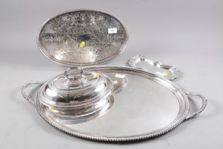 A silver plated two-handled tea tray, a plated gallery tray, a plated entree dish and cover, and a