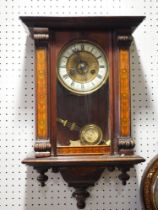 An early 20th century painted walnut carved wall clock with compensating pendulum, 21" high (no