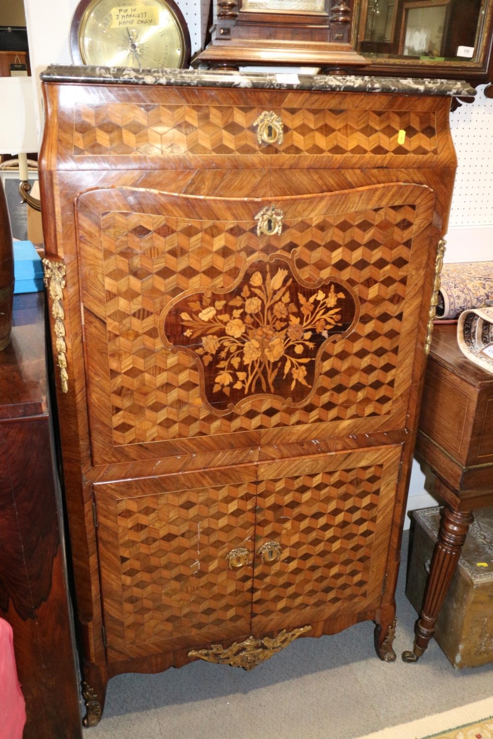 An early 19th century French kingwood parquetry and marquetry gilt metal mounted fall front