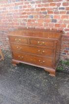 A 1930s carved mahogany dressing chest of two short and two long drawers, on ogee bracket supports