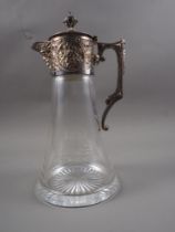A silver mounted claret jug with star cut base