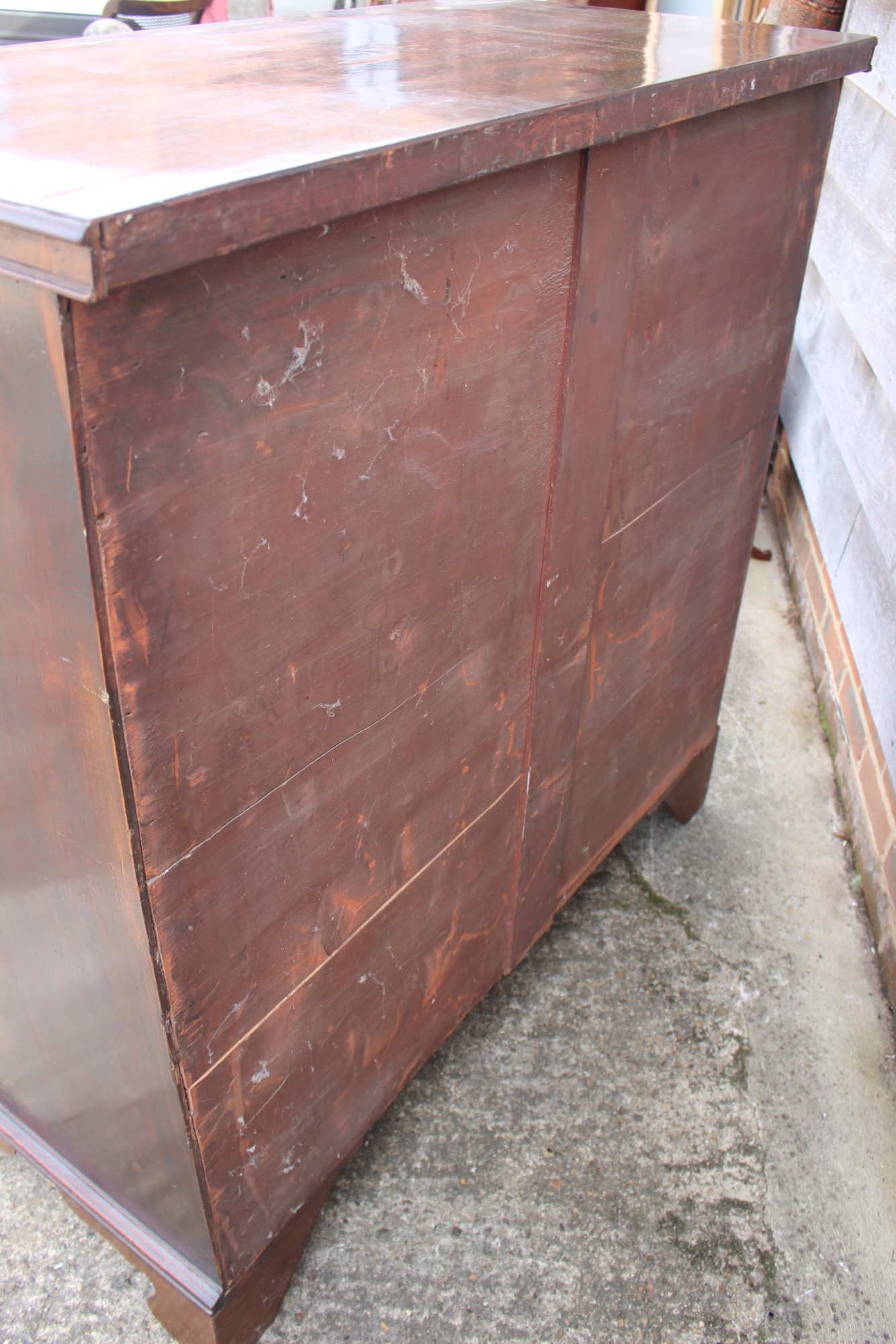 A late Georgian mahogany chest of two short and four long graduated drawers with stamped brass - Image 5 of 5