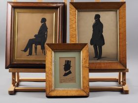An early 19th century silhouette portrait of a seated gentleman, 9 1/2" x 7 1/2", in rosewood frame,