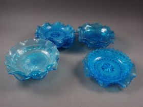 Two pairs of blue glass dishes with shaped rims, 8 3/4" dia, six other similar dishes and bowls, a