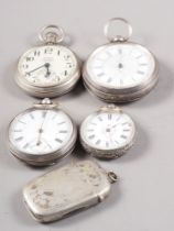 Three various silver cased pocket watches, a nickel cased pocket watch, a plated vesta case and a