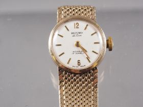 A lady's Record DeLuxe 9ct gold wristwatch, 27g gross