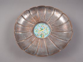 A Japanese copper petal shaped bowl with central enamelled panel with bird and flower decoration and