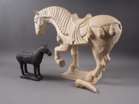 A Tang style terracotta horse, 14 1/2", (damages to tail), and another smaller similar