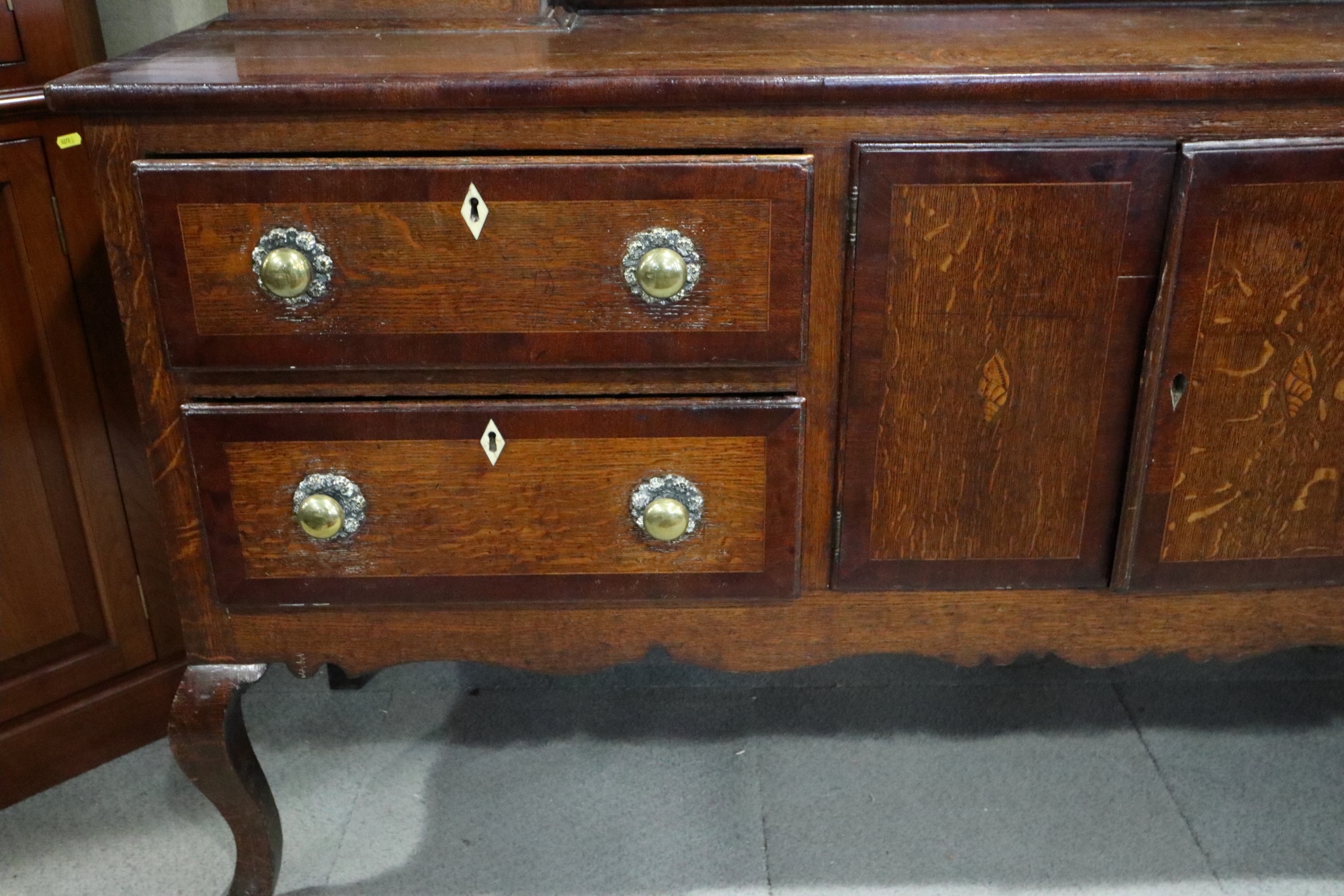 An early 19th century oak and mahogany banded dresser, the upper section fitted open shelves with - Image 2 of 6