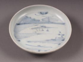 A Chinese blue and white saucer dish, decorated riverscape, from the Vung Tau cargo, 4 3/4" high (