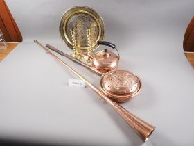 A Cairoware inlaid brass tray, two copper and brass coaching horns, a copper warming pan, a pair