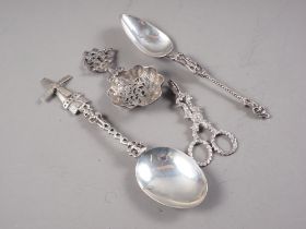 A Berthold Muller white metal sifter spoon, two Continental white metal spoons, and a pair of