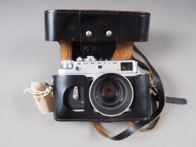 A Zorki-4 rangefinder camera with Jupiter 50mm f2 lens, in ever-ready case, an Exacta VX1000 SLR