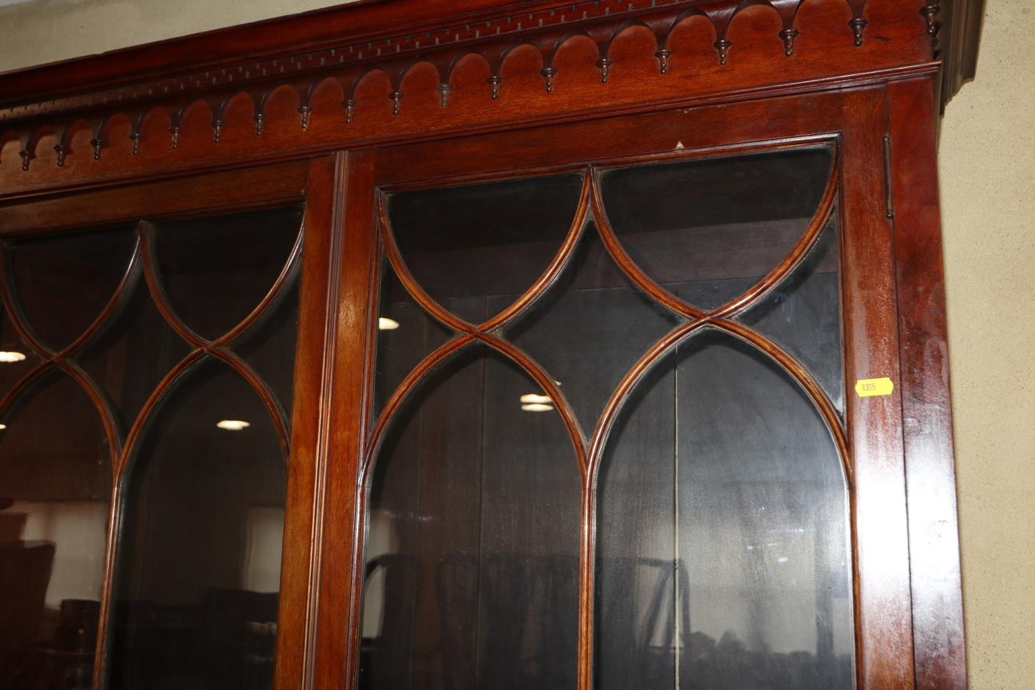 A 19th century mahogany bookcase, the upper section enclosed Gothic lattice glazed doors, over two - Image 2 of 4