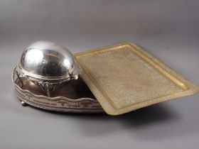 A silver plated breakfast dish, a plated gallery tray and an Egyptian engraved brass tray