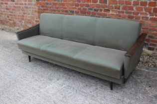 A mid century Scandinavian polished as walnut showframe bed settee, on splay supports (retaining