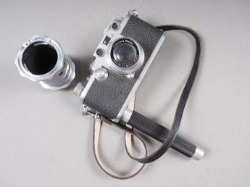 A Leica DRP rangefinder camera, No 666946, with Sumar 50mm f1.2 lens, No 315659, and hand grip