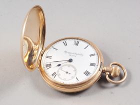 A Rockford Watch Co, 9ct gold cased full hunter pocket watch with white enamel dial, Roman