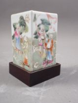 A Chinese porcelain square section brush pot, decorated figures, seal mark to base, 3" high, on