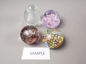 Two millefiori paperweights, four Caithness paperweights and a number of other modern