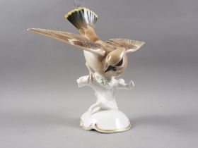 A Bavarian porcelain model of a "Silk Wing" bird, 10" high