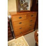 A late 19th century mahogany and banded chest of two short and three long graduated drawers, on